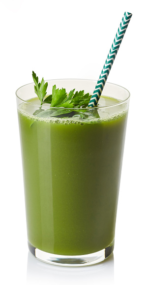 Glass of fresh green vegeteble juice isolated on white background