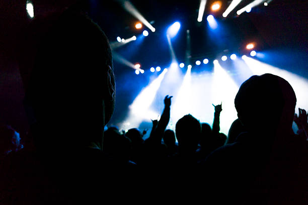 istock silhouette people rock show 610690570