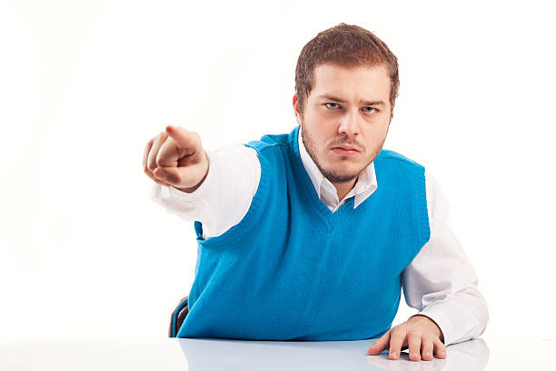 istock Angry young businessman pointing a finger 610690608