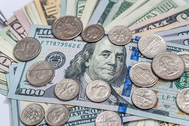istock usa dollar bills and coins 610690848