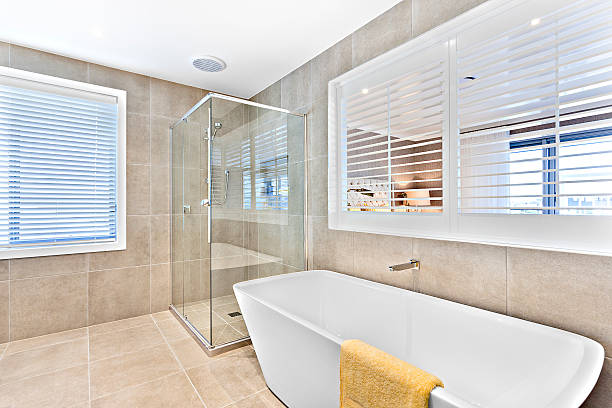 istock White wash basin and glass panel shower area  with tiles 610742980