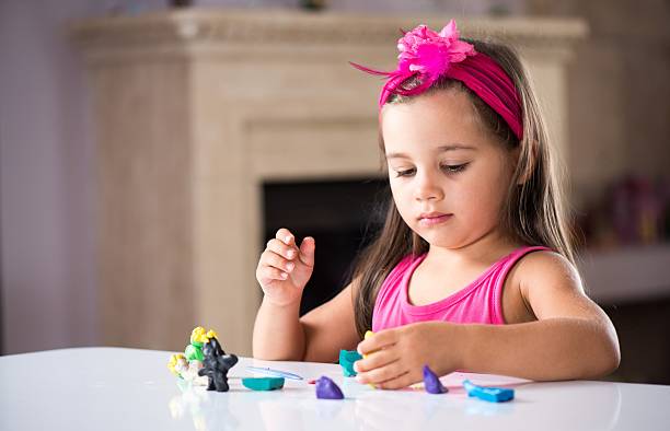 istock Little Girl Playing At Home 610743018