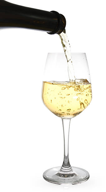 istock white wine pouring in a glass from a bottle 610743484