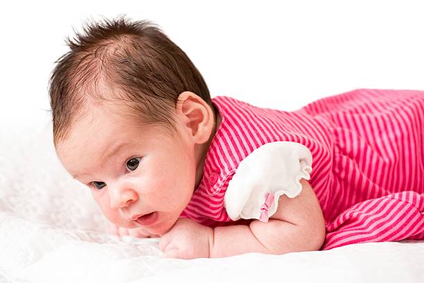 istock Newborn Baby Girl Discovering Around 610743638