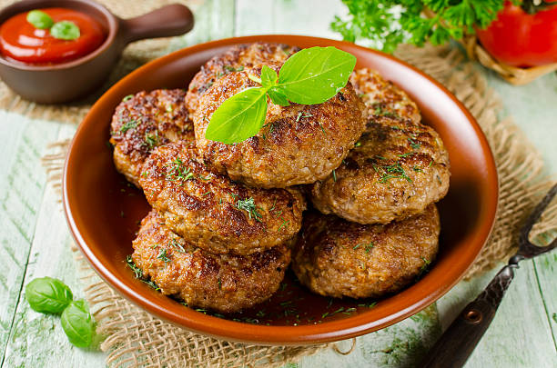 istock Juicy delicious cutlets with oatmeal. Rustic style 610743682