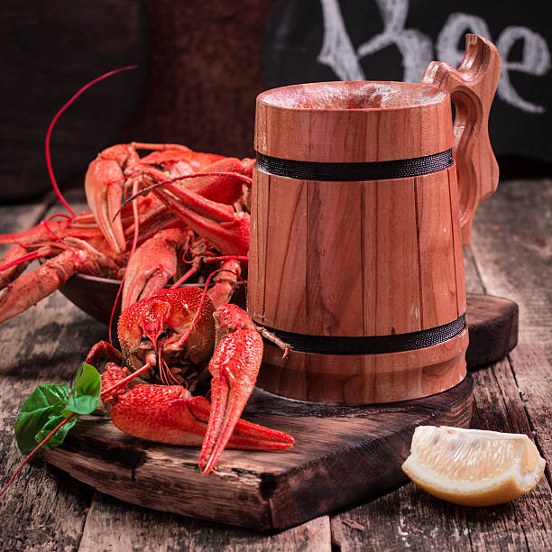 istock boiled crawfish and beer on a wooden background 610743956