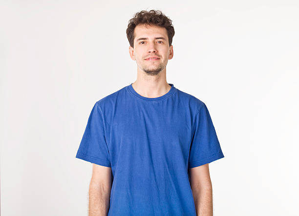 istock Handsome young man in blue portrait. 610744910