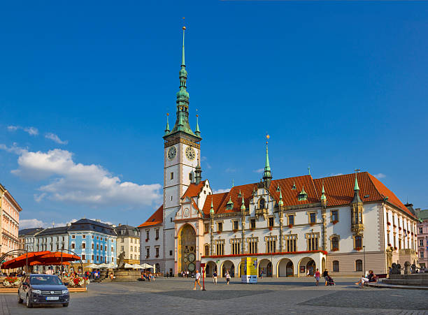 Olomouc, Czech Republic - September 16, 2016: Main square of the city Horni namesti with medieval city hall and walking people 