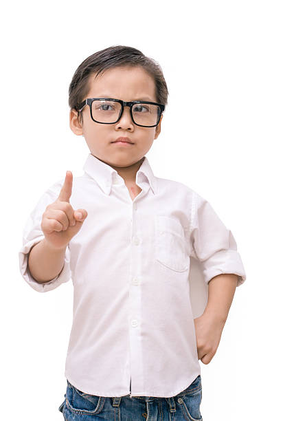 istock kid asia boy showing the number one 610745520