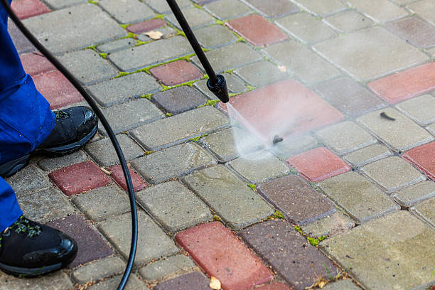 istock pavement cleaning with high pressure washer 610745664