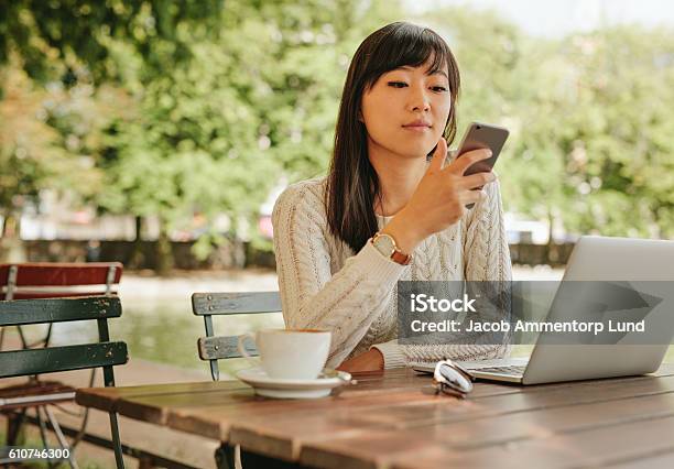 Attractive Woman Using Smartphone At Coffee Shop Stock Photo - Download Image Now - Cafe, Computer, Convenience