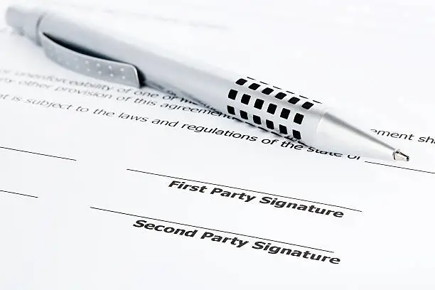 Photo of pen on contract