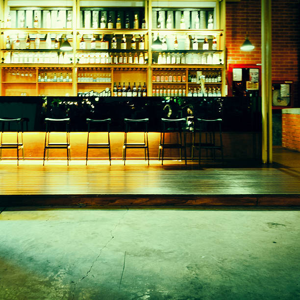 istock Interior of a modern pub or bar at night 610747948