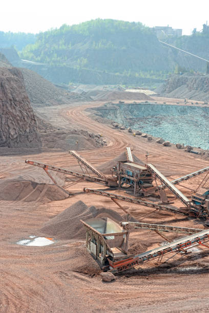stone crusher in an open pit mine of porphyry rocks.