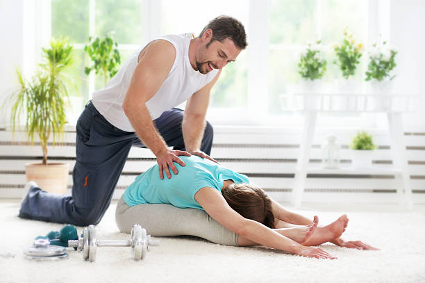 istock couple working out together  at home 610751012