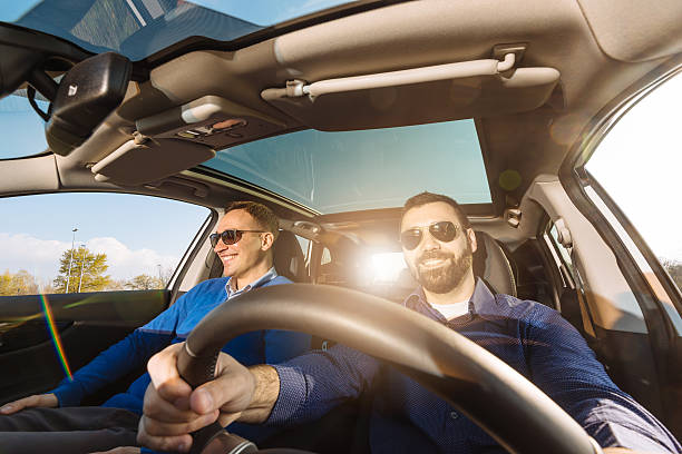 Wide angle image of two adults in car