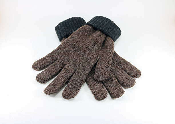 istock close up brown glove on white isolated. 610752450