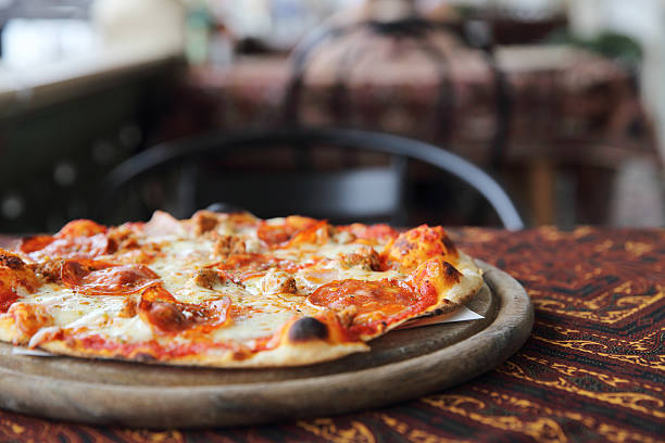 istock pepperoni pizza on wooden 610753416