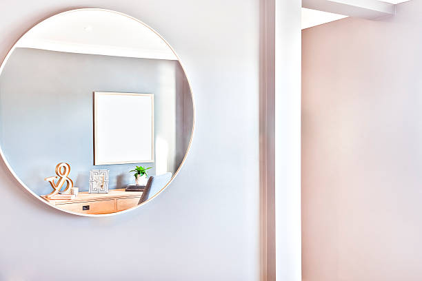 istock Round mirror glass on the wall close up 610758586