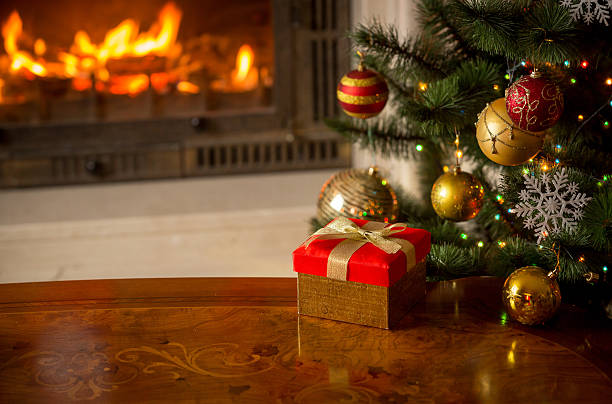 istock Christmas background with present, Christmas tree and fireplace 610759256