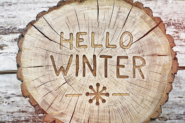 Hello winter. Carving wood for your design. Congratulatory background stock photo