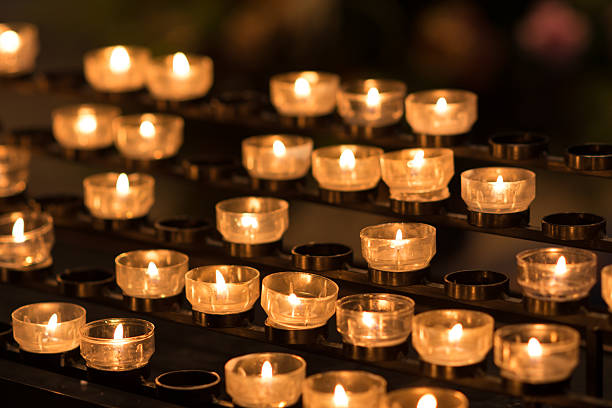 istock votive candles on a rack in a curch 610760728