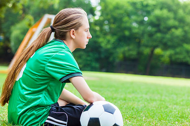 istock Female soccer player is sad after losing game 610765654