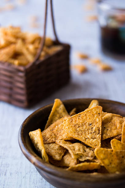 istock Chips (Snacks) and Beverage on a white wooden surface. 610766598