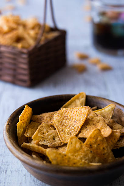 istock Chips (Snacks) and Beverage on a white wooden surface. 610766766