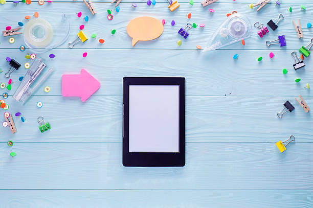 istock E-book and bright colorful stationery items. 610767058