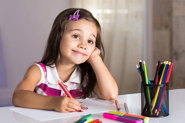 istock Little Girl Drawing Pictures 610770064