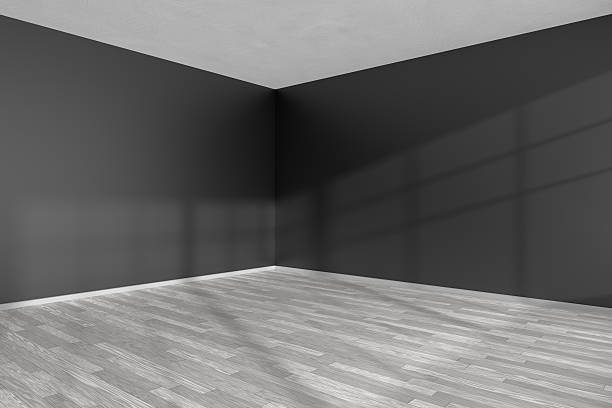 istock Empty room corner with white parquet floor and black walls 610770264