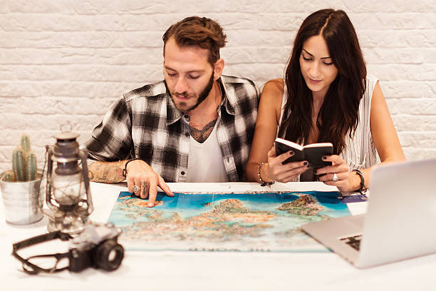 istock Young couple in love planning a trip 610770352
