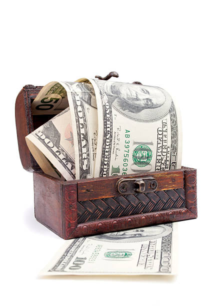 istock American Dollars jump from a decorative wooden chest 610770364