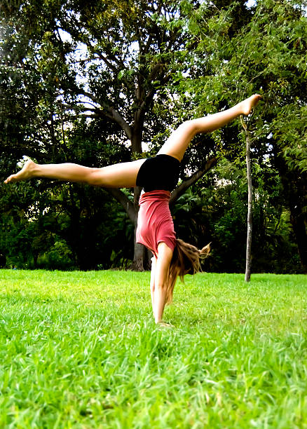 istock Beautiful ballerina doing exercises for dancing outdoors 610770444