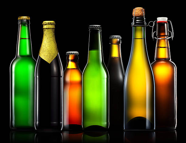 istock Set of beer bottles isolated on black background 610770700