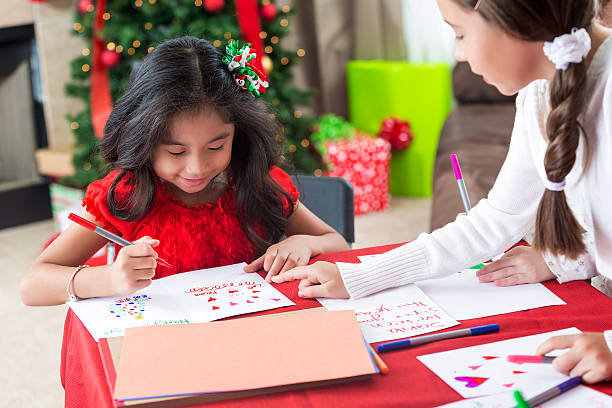 istock Sisters make homemade cards at Christmastime 610772706