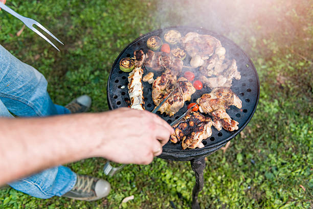 istock Man Cooking chicken batter On Barbecue 610774172