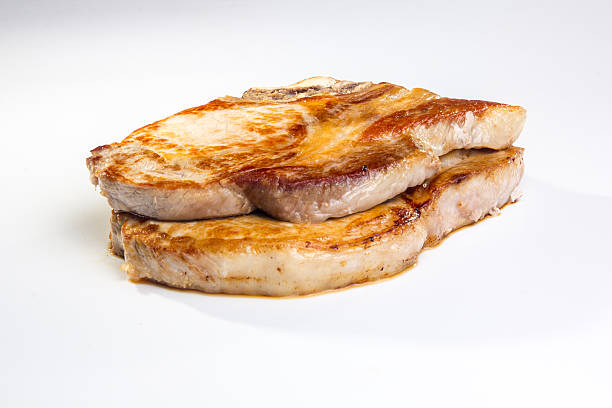 istock Two pieces of fried pork loin on a white background. 610774312
