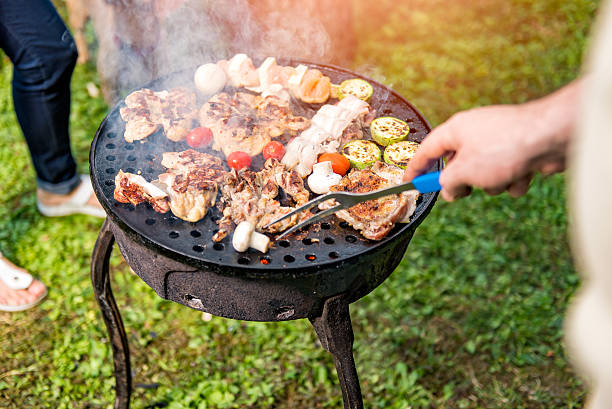 istock Man Cooking chicken batter On Barbecue 610774390