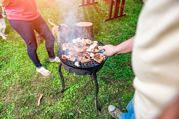 istock Man Cooking chicken batter On Barbecue 610774484