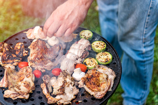 istock Man Cooking chicken batter On Barbecue 610774672
