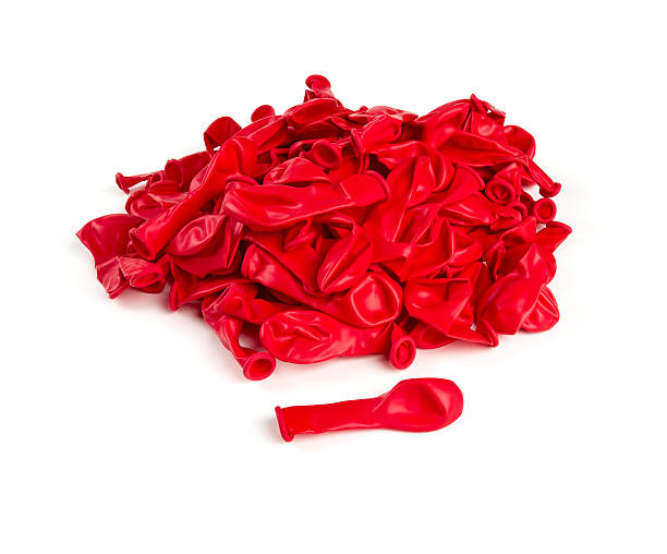 istock deflated red air ballons isolated on white 610774808