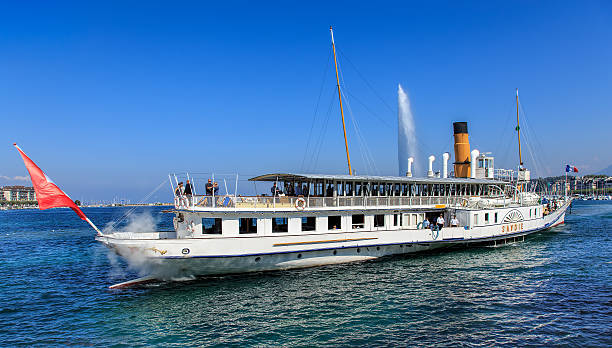 Geneva, Switzerland - 24 September, 2016: view on Lake Geneva with MS Savoie passing with people on board. Lake Geneva is a lake on the north side of the Alps, shared between Switzerland and France.