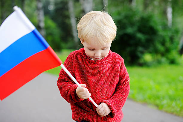 istock Toddler boy holding russian flag 610779904