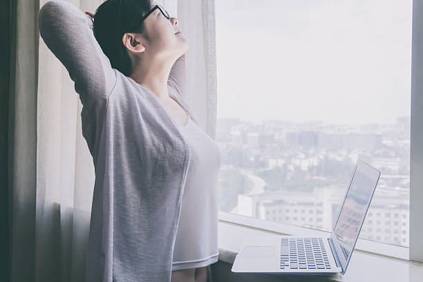 istock Businesswoman stretching and looking up 610780370