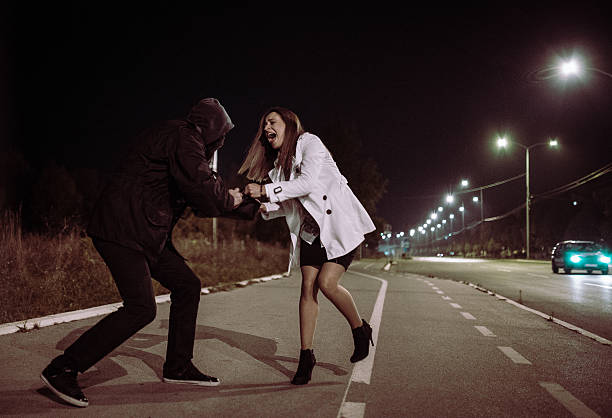 istock Robber stealing businesswoman bag 610780982