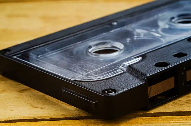 Photo of the cartridge for the tape recorder on a wooden table