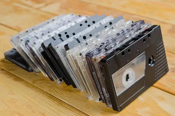 Photo of the cartridge for the tape recorder on a wooden table