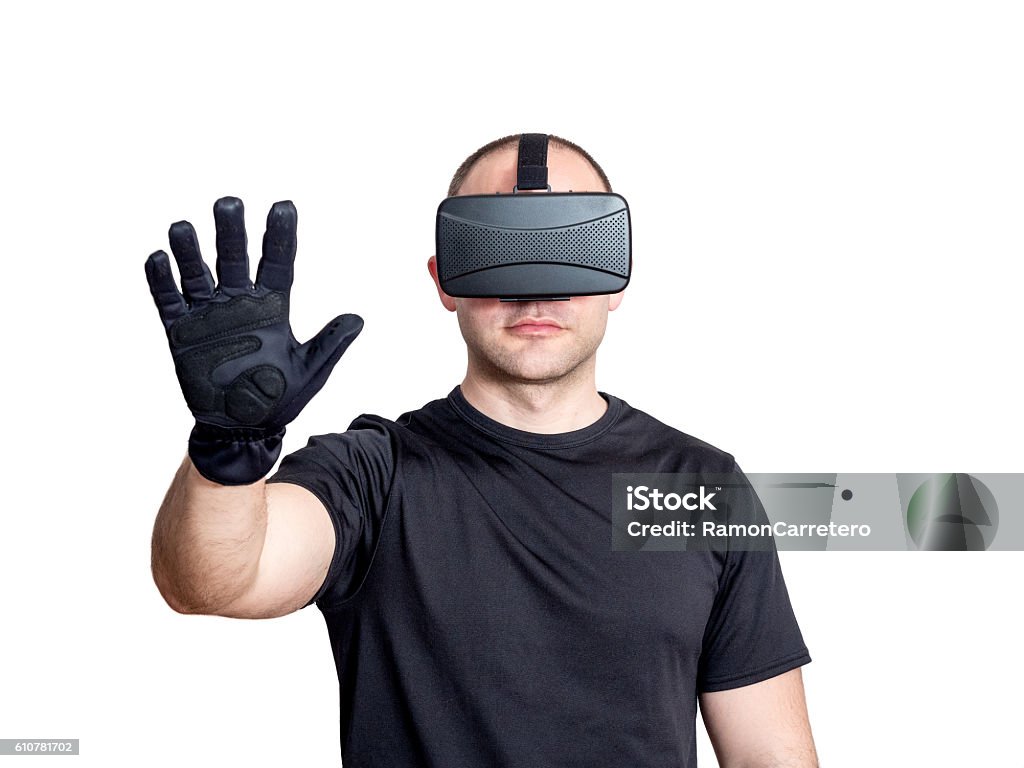 Man using virtual reality headset and touching a virtual interface Man using virtual reality headset and touching virtual interface isolated on white background Glove Stock Photo